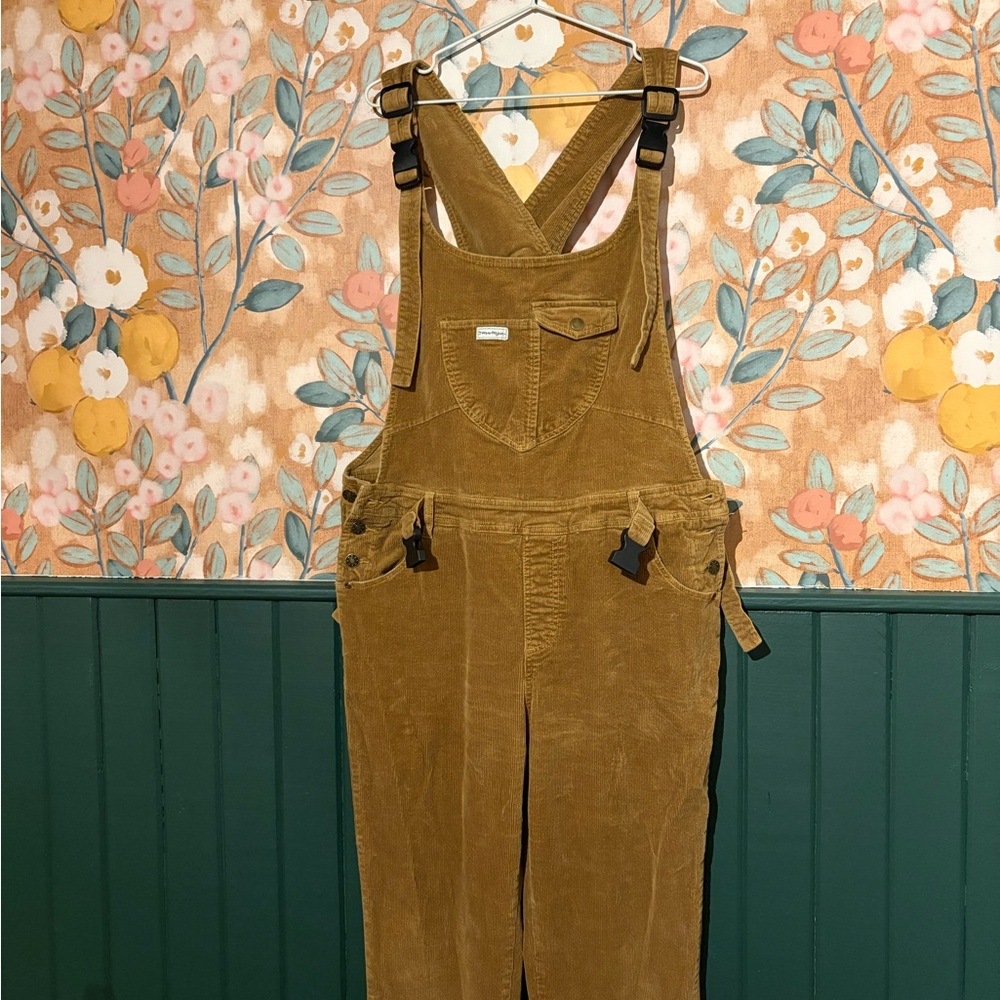 Corduroy Mumsie baby wearing Overalls in Mustard